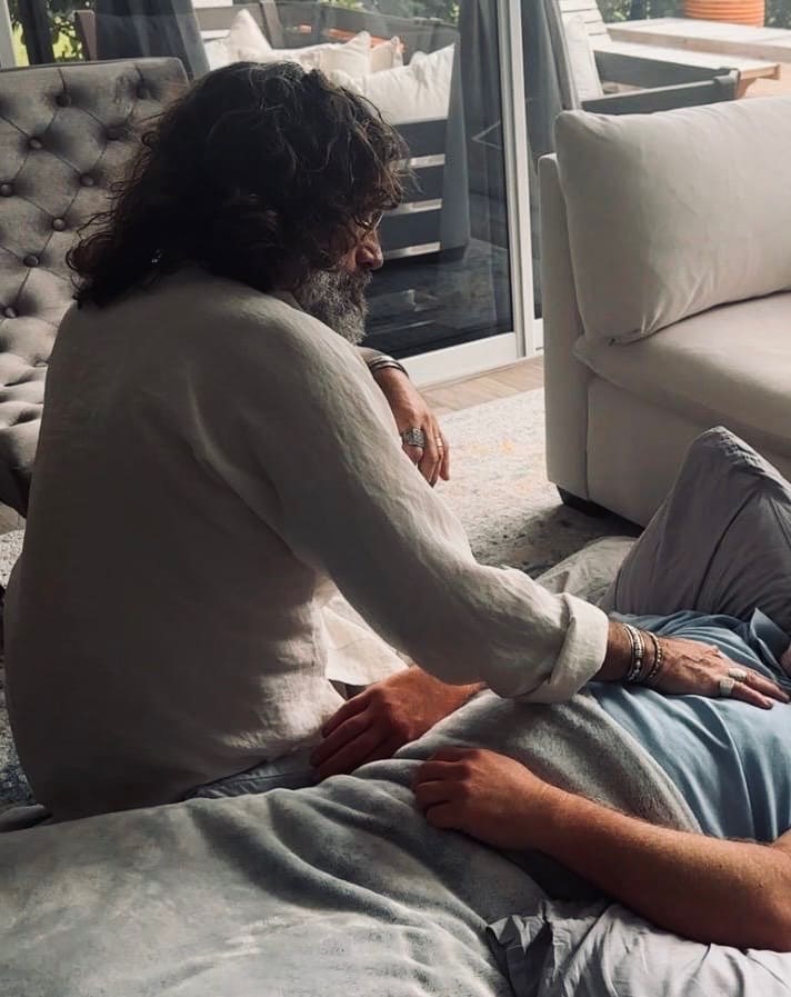 A one-on-one session, one person resting while another sits close by